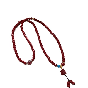 Red agate beaded bracelet with a lucky cat pendant and engraved Fu characters