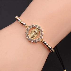 Religious Virgin Mary bracelet with gold and silver beads on adjustable black cord