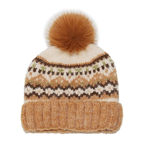 Close-up of fair isle knit beanie featuring a large brown pom-pom and geometric patterns
