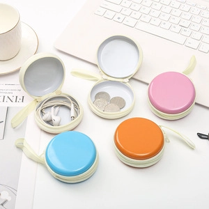 Macro view of macaron-colored zipper storage cases for earphones and small digital cables