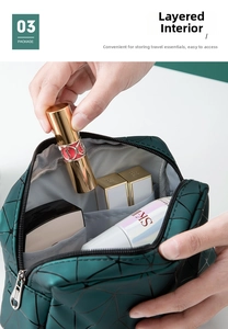 Detailed macro view of the interior layered mesh pockets of dark green cosmetic bag