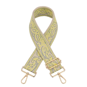 Detail of adjustable paisley jacquard bag strap with gold-tone swivel lobster clasps