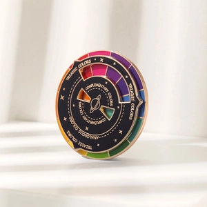Macro view of a colorful spinning color wheel enamel pin with sun and blind shadows
