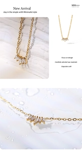 Detailed close-up of 18k gold-plated necklace with five marquise-cut zircon stones
