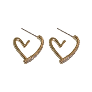Elegant gold heart earrings featuring sparkling cubic zirconia studs on white background