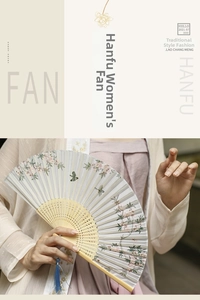 Detailed close-up of a vintage folding fan with pink floral patterns and blue silk tassel