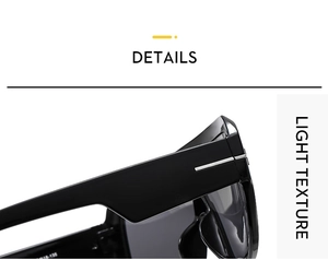Close-up of the metal hinge and T-shaped inlay detail on black oversize sunglasses