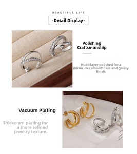 Detailed macro view of multilayer polished hoop earrings with sparkling zircon inlay