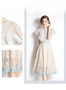 Detailed views of lace midi dress featuring ruffled sleeves and light blue floral trim