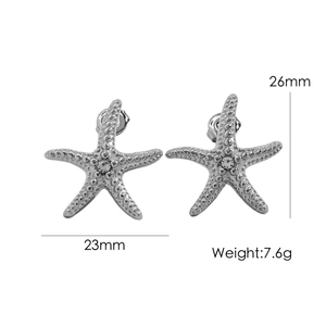 Vue détaillée des boucles d'oreilles étoile de mer montrant les dimensions et le poids