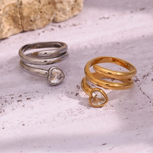 Dual layer 18K gold plated snake head heart crystal ring on marble background