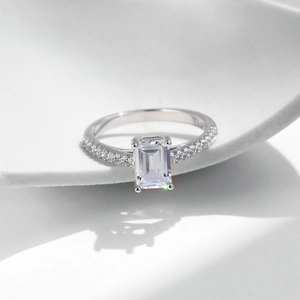 Elegant S925 sterling silver ring featuring an emerald-cut centerpiece with side accents