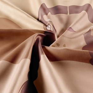 Close-up of bohemian tapestry showing fine silk texture and earth-tone printed pattern
