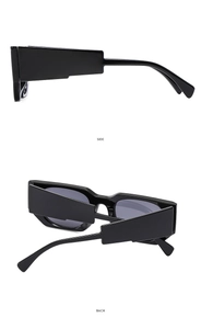 Detail view of stylish square frame sunglasses featuring wide temples and glossy black finish