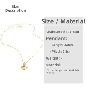 Detail view of nautical gold necklace with helm, sailboat, starfish charms and zircon