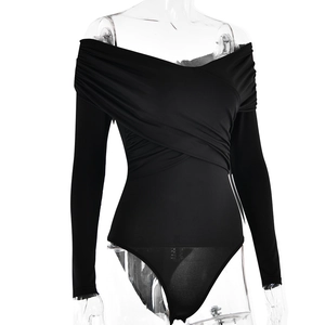 Detail view of the elegant black V-neck bodysuit with criss-cross pleated chest design