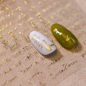 3D embossed butterfly and gold script nail stickers in white and olive green colors