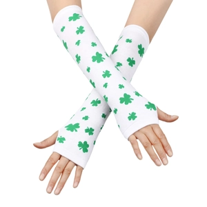 Close-up of white knitted fingerless arm warmers with green shamrock patterns for parties