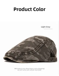 Detail view of camouflage flat cap showing washed texture and metal adjusting buckle