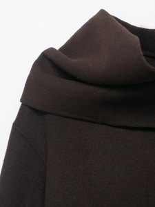 Detail of high collar design on a dark brown wool blend coat with thick texture