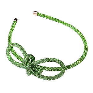 Elegant green rhinestone headband featuring a sparkling crystal bow on a metal frame