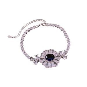Exquisite silver flower bracelet with oval blue gemstone and cubic zirconia accents