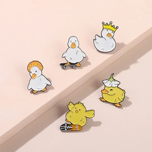 Funny enamel duck pins set featuring crown and skateboard designs for fashion accessories
