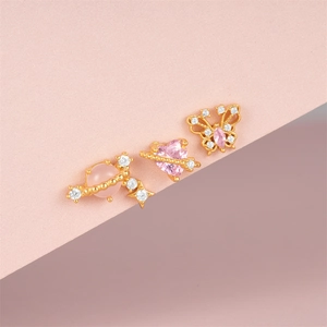 Close-up of S925 silver pink heart planet earrings with zircon stones and gold plating