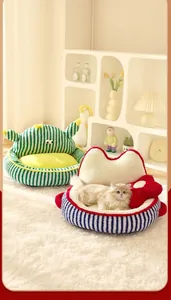 Detailed view of striped cactus and heart-shaped plush pet beds on white carpet