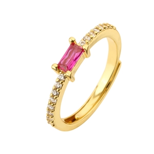 Detail of adjustable gold ring featuring a rectangular pink gem and white zircon accents
