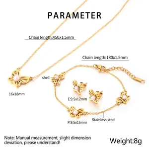 Detail view of butterfly jewelry set in gold stainless steel with shell inlays and specs
