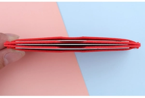 Top view of ultra-thin red card holder with multiple slots and compact design