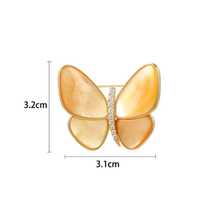 Elegante broche de mariposa dorada con alas de nácar naranja y cristales blancos
