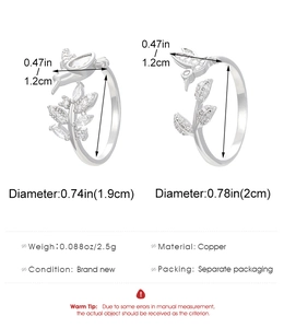 Detail view of silver hummingbird ring with crystal leaves and copper material specs