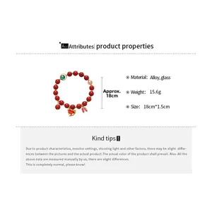 Detail view of red glass beaded bracelet with heart pendant and product dimensions
