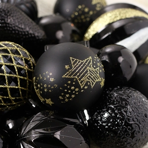 Black and gold Christmas ornaments set featuring star patterns and glitter textures