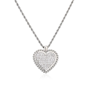 Macro shot of silver heart pendant with pave cubic zirconia and rope chain detail