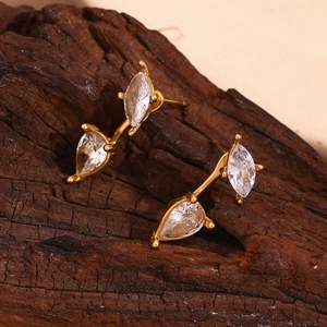 Macro shot of 18K gold plated earrings with pear and marquise cut cubic zirconia