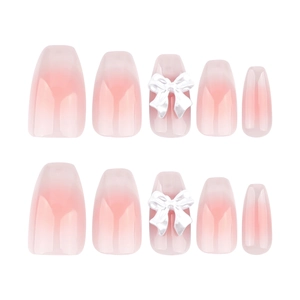 French cat eye press-on nails with 3D white bows and pink gradient ballerina shape