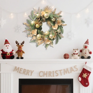 Christmas wreath with golden balls and pine needles on a white fireplace background