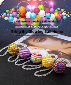 Close-up of sparkling rhinestone Christmas ball pendants with glowing crystal beads