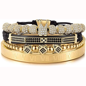Detail of four-piece men's bracelet set with gold crown and Roman numeral bangle
