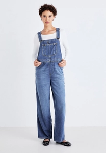 Detail of dark blue denim overalls for women with wide leg cut and front pocket