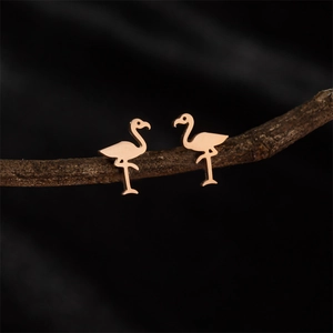 Artistic flamingo shaped stud earrings in rose gold finish on natural branch
