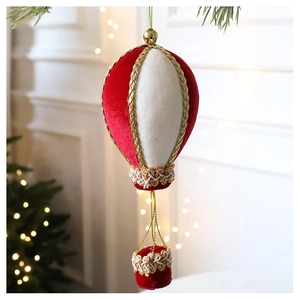 Detail of red and white velvet hot air balloon Christmas ornament with gold braided trim
