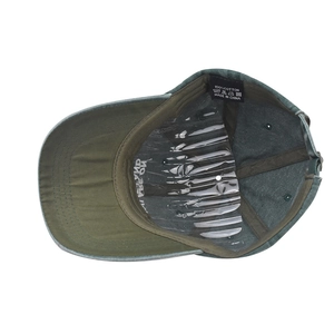 Detail view of washed olive green cotton baseball cap showing interior sweatband and label