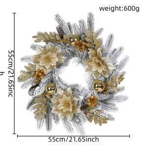Detailed view of flocked Christmas wreath with gold poinsettias and frosted pine needles