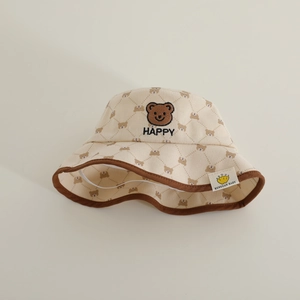 Beige corduroy bear print baby bucket hat with quilted texture and chin strap