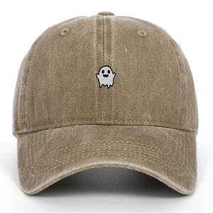 Close-up of ghost embroidery detail on a vintage washed cotton baseball cap in khaki