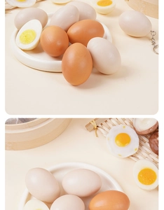 Macro shot of realistic artificial boiled eggs with keychains and miniature bamboo steamer